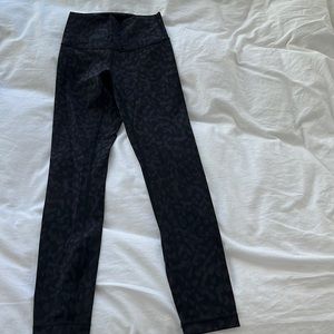 Lululemon size 0 3/4 leggings. Worn once. Black camo print.